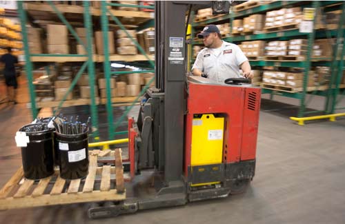 Forklift in warehouse.